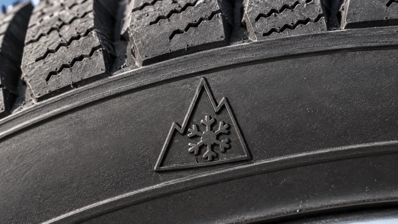 Molded UTQG markings on a tire sidewall: treadwear, traction, and temperature grades