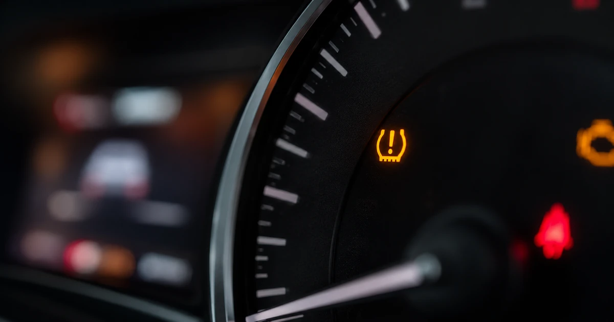 Toyota dashboard with the TPMS tire pressure warning light illuminated